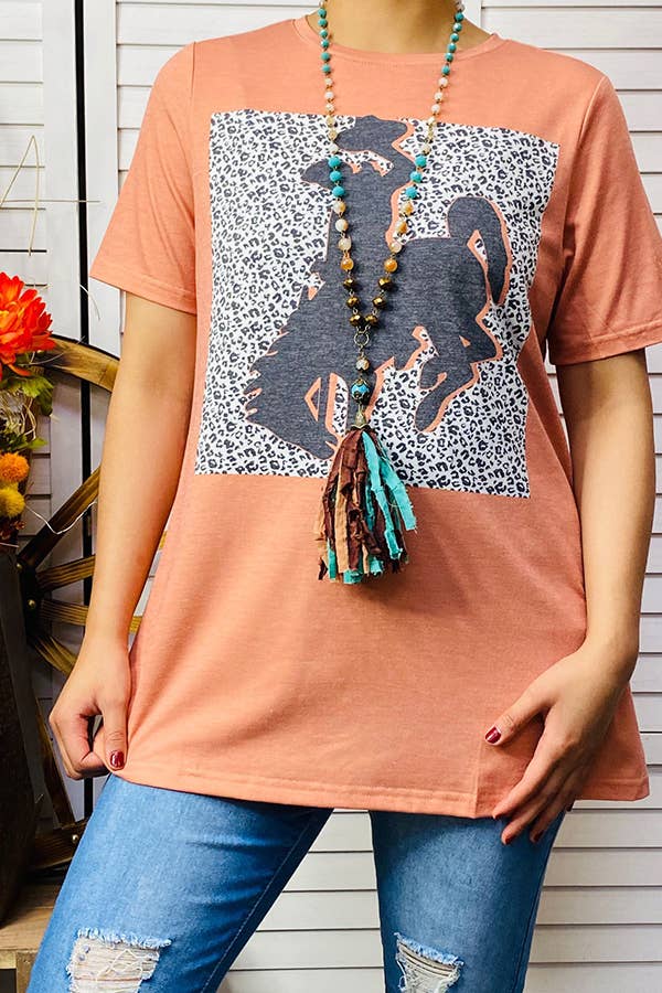 Coral top with bronc rider graphic